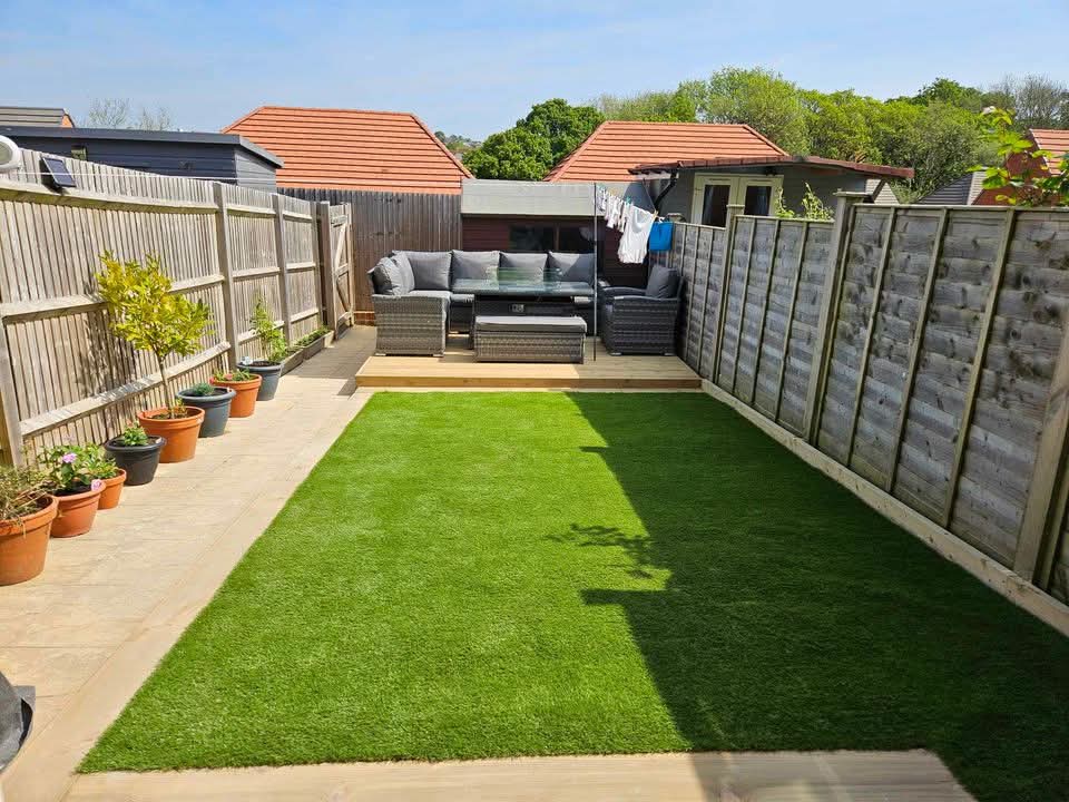 Finished artificial lawn and decked seating area